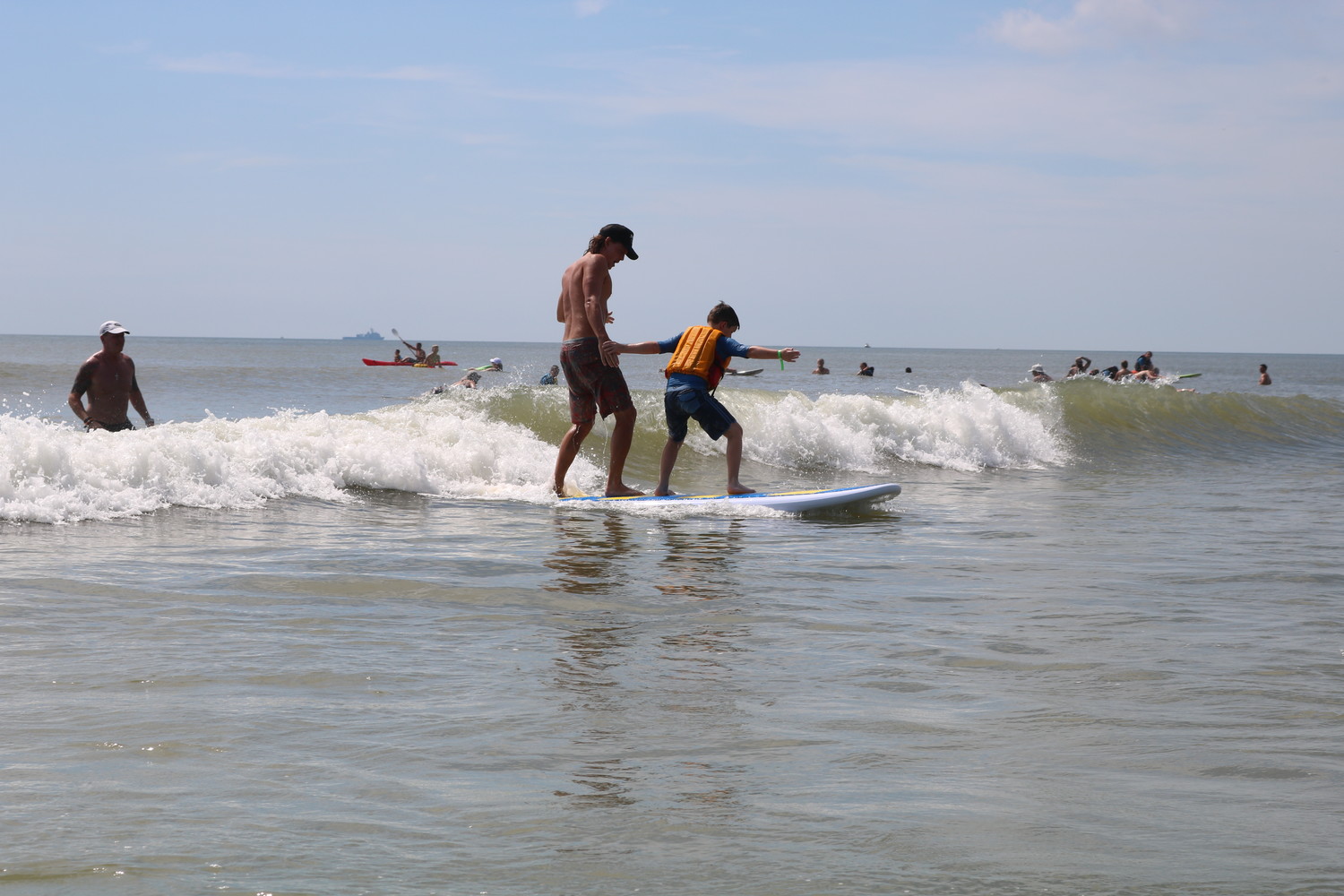 Local children and young adults with autism and related disabilities surf at the HEAL Foundation’s 13th annual surf camp held June 26-27 in Neptune Beach.